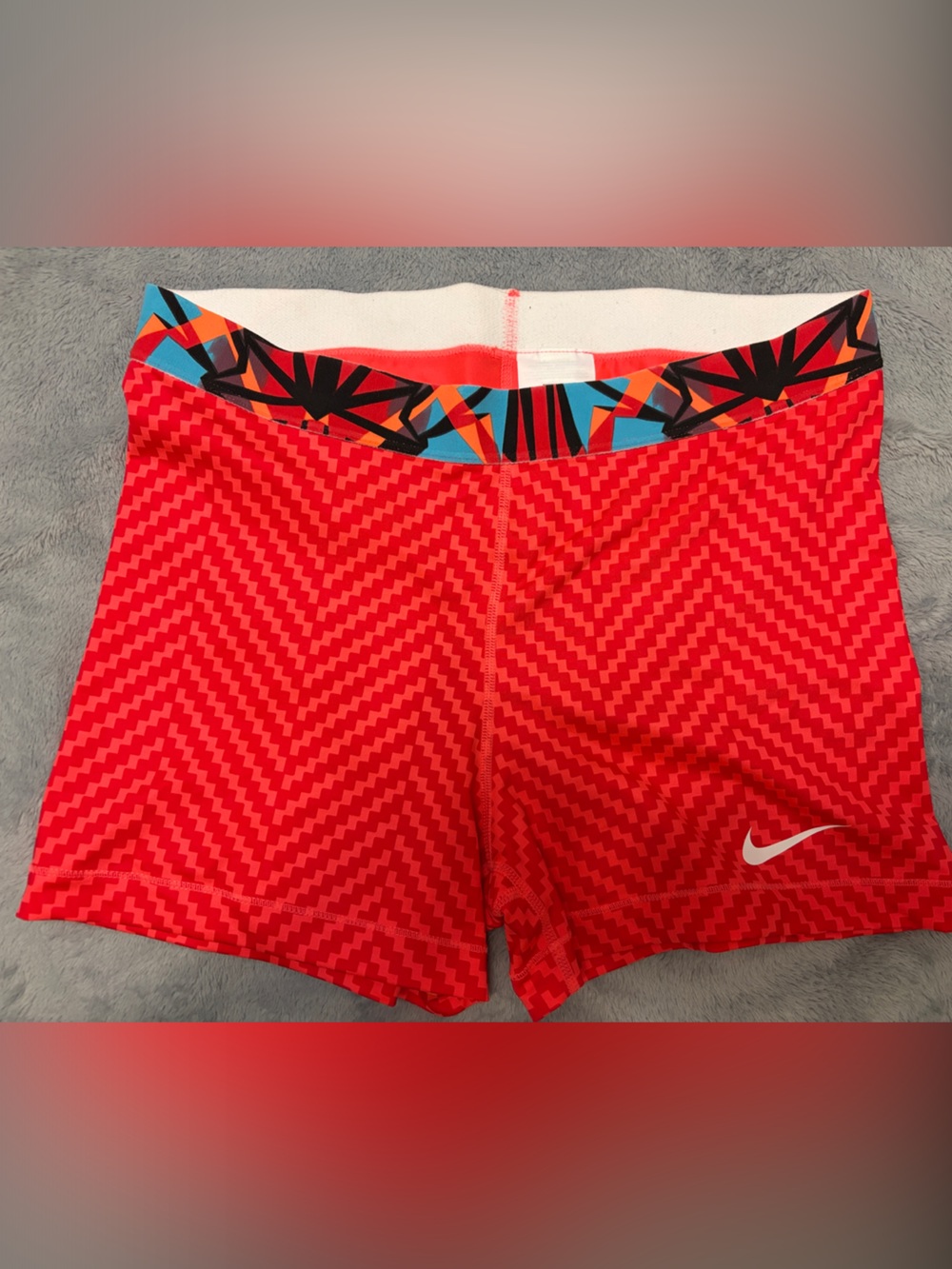Nike Women’s Red Compression Shorts with Multicolor Geometric Waistband